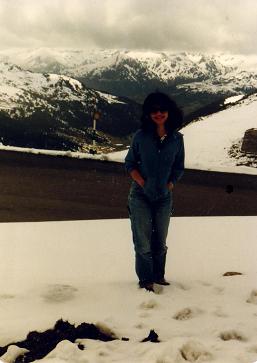 Girl in Andorra standing in front of the Pyrenees